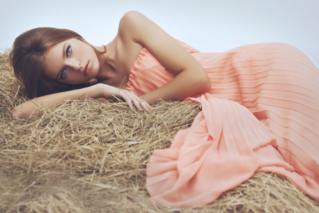 Girl lying on hay